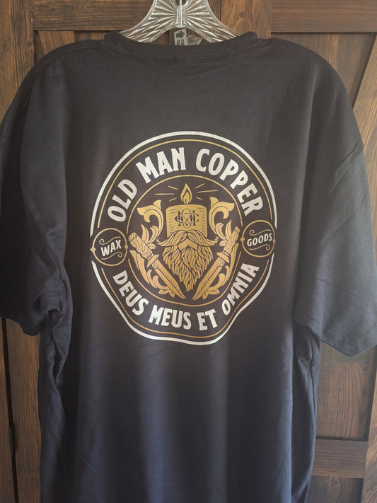 Black jacket with gold and white logo on a wooden surface